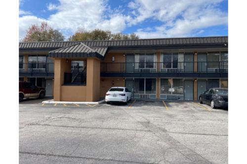 a parking lot in front of a building at Budget Inn Greenville By Hotel O I-85 in Greenville
