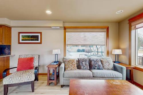 a living room with a couch and a table at Driftin' Cabanas in Chelan