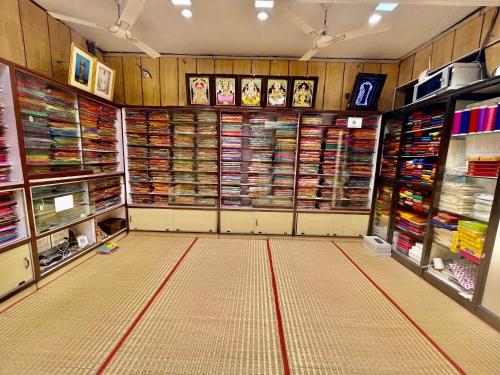 a large room with a store with a large amount of items at AKG Lodge in Kanchipuram