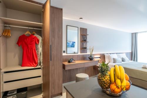 Un ou plusieurs lits dans un hébergement de l'établissement CENTRO Suites