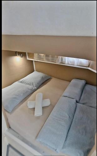 a room with two beds with a cross on it at Beatrix boat in San Miguel de Abona