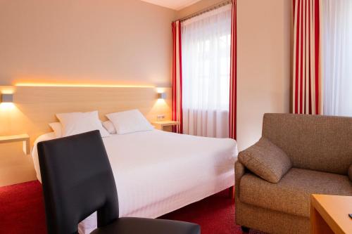 Katil atau katil-katil dalam bilik di Hôtel Restaurant Logis Auberge Sundgovienne