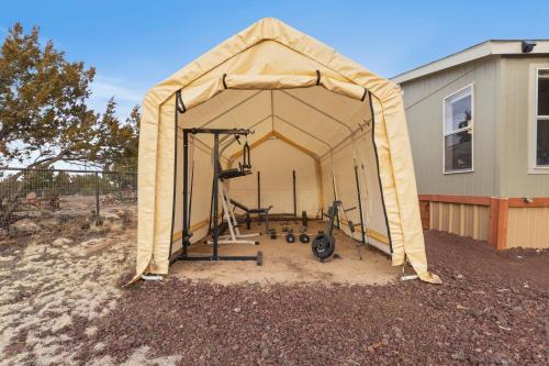 a gym in a tent in front of a house at Near Gc Train-1acre-gym-king-parking-kitchen-wifi in Williams