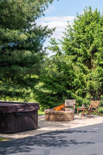 a fire hydrant and a bench in a park at Sage Brush Cabin in Millersburg