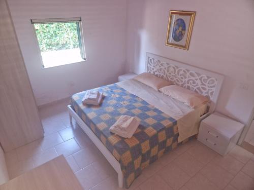 Postel nebo postele na pokoji v ubytování casa vacanza sul mare 4