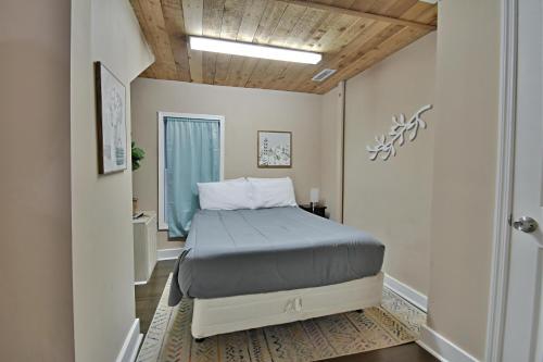 a small bedroom with a bed in a hallway at Serene Retreat in Knoxville