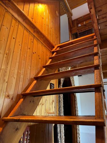 a set of wooden stairs in a wooden house at Chata Olšovka in Jedovnice