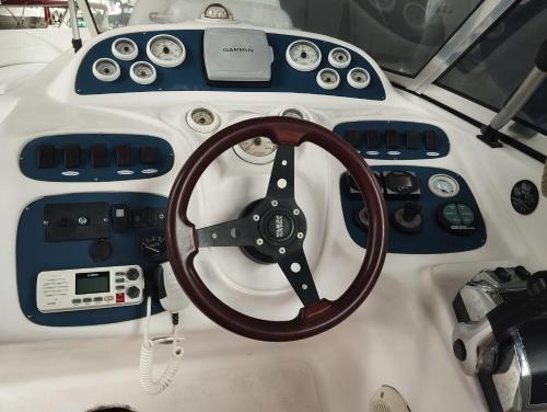a steering wheel and other items on a boat at Suite pé na areia - trilha e praia in Angra dos Reis