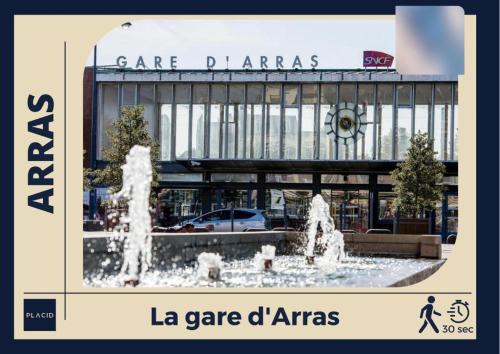a picture of a fountain in front of a building at L'Europa - Gare - Centre - Wifi in Arras