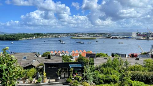 a view of a river with houses and boats at Panorama Byfjorden in Stavanger