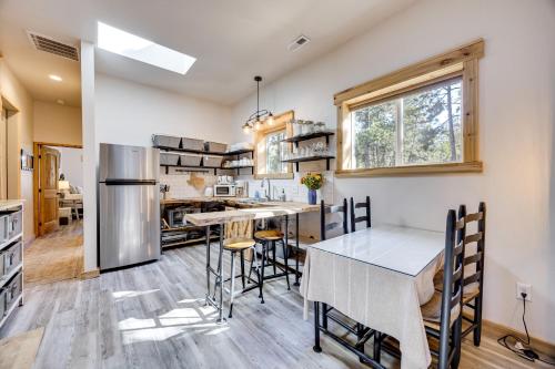 a kitchen and dining room with a table and chairs at 13 Mi to USAFA Peaceful Colorado Springs Getaway! in Gleneagle