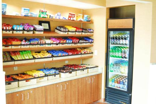 a store with a refrigerator filled with lots of food at Holiday Inn & Suites Virginia Beach - North Beach by IHG in Virginia Beach