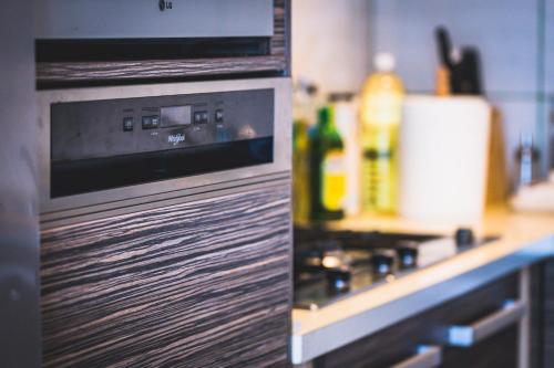 a kitchen with a stove and a counter top at Ferde Kemping és Apartment in Kapolcs