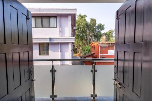 an open door with a view of a building at 3BHK Villa - The Blue Pearl Varca Beach in Varca