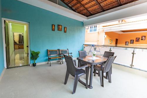 a dining room with a table and chairs at 3BHK Villa - The Blue Pearl Varca Beach in Varca