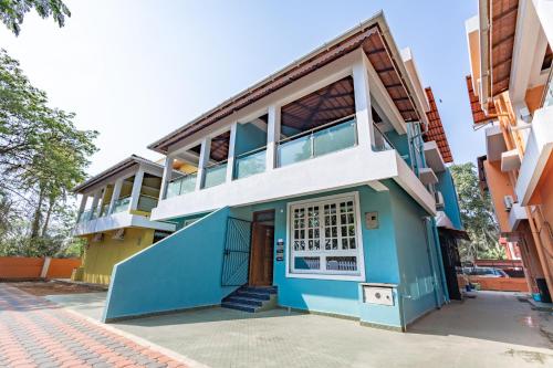 a house with a blue and white facade at 3BHK Villa - The Blue Pearl Varca Beach in Varca