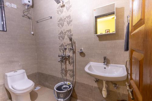 a bathroom with a toilet and a sink at 3BHK Villa - The Blue Pearl Varca Beach in Varca