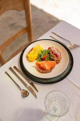 a plate of food on a table with a plate of food at Agroturisme Es Racó De Maria in Maria de la Salut