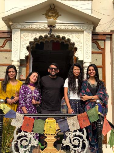 a group of people standing in front of a building at Whereabout Hostel Udaipur in Udaipur