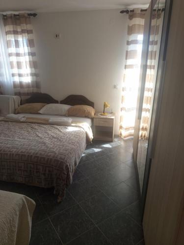 Ένα ή περισσότερα κρεβάτια σε δωμάτιο στο Apartman aleksej