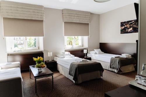Posteľ alebo postele v izbe v ubytovaní B&B Wieniawa PARKING I ŚNIADANIE W CENIE! BREAKFAST AND PARKING INCLUDED!
