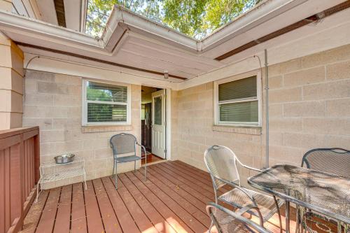 a porch with chairs and a table on a deck at 2 Mi to FSU and FAMU Home with Spacious Deck! in Tallahassee