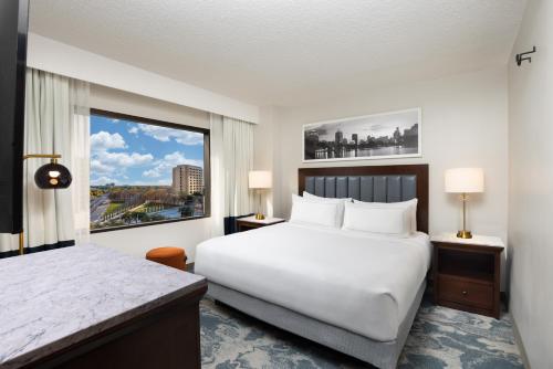 a hotel room with a large bed and a window at DoubleTree by Hilton Houston Medical Center Hotel & Suites in Houston