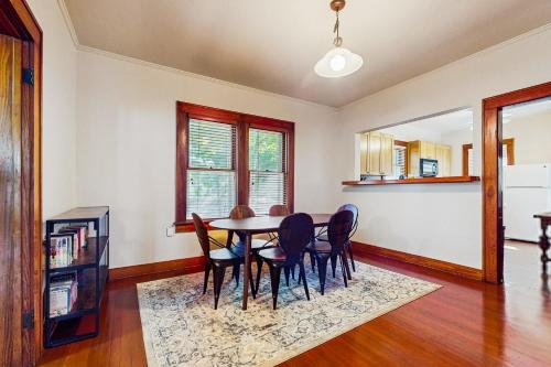 a dining room with a table and chairs at The Historic Garison House in Buda