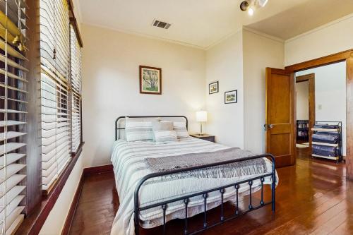 a bedroom with a bed in a room at The Historic Garison House in Buda