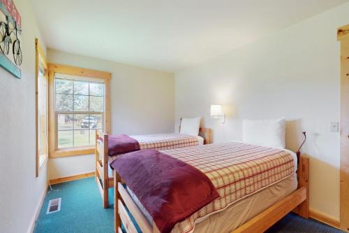Ένα ή περισσότερα κρεβάτια σε δωμάτιο στο The Cozy Chalet