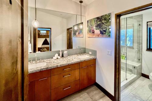 a bathroom with a double sink and a shower at Truckee Mountain Retreat in Truckee