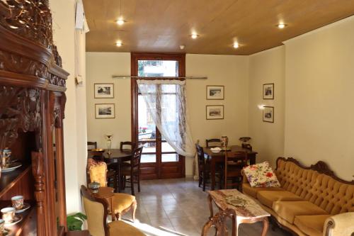 a living room with a couch and a table at Themis - Θέμις Apart Hotel in Loutra Edipsou