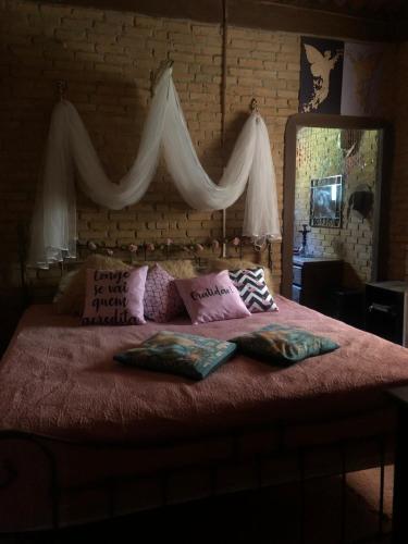 Postel nebo postele na pokoji v ubytování Chalé Romântico