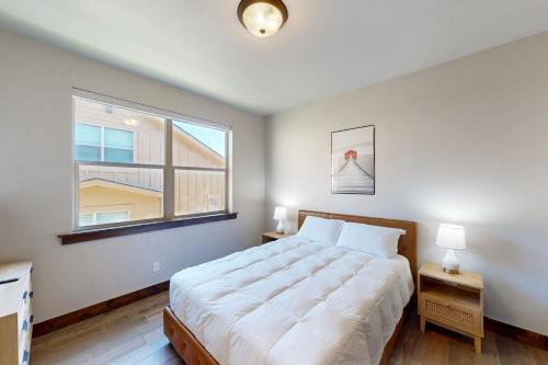 a bedroom with a large bed and a window at High Line View in Kamas