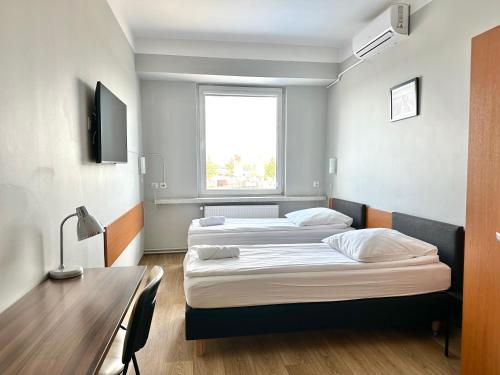 Posteľ alebo postele v izbe v ubytovaní Premium Hostel & Bistro - HostelPremium pl