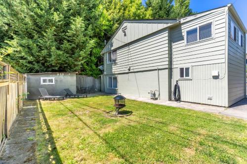 a backyard with a building and a yard with a grill at Entire Apt in South Seattle Workspace and Yard in Seattle