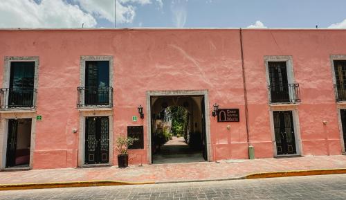 a red building with an open door at Casa Santa María Valladolid in Valladolid