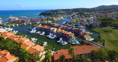 an aerial view of a marina with boats in the water at Park Royal Homestay Club Cala Puerto Rico in Humacao