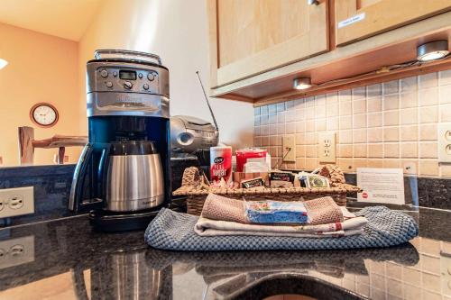 a coffee maker on a counter in a kitchen at Incredible Views w Garage on Lake and bike trail in Tofte
