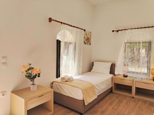 Ένα ή περισσότερα κρεβάτια σε δωμάτιο στο Helena Apartments in Paradisi