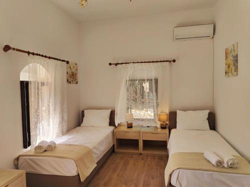 Ένα ή περισσότερα κρεβάτια σε δωμάτιο στο Helena Apartments in Paradisi