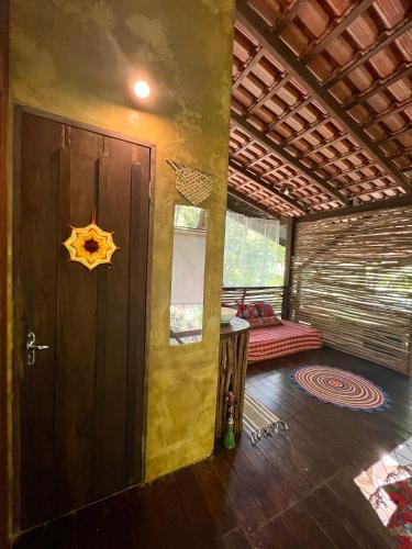 a room with a door and a star on the wall at Vila AMZ, Hostel Experiências in Alter do Chao