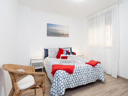 a bedroom with a bed and a chair at Trip Medano England Centro in El Médano