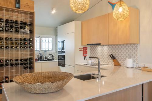 a kitchen with a sink and a counter top at Prainha Residences-A17 -Portimão in Alvor