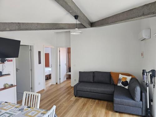 a living room with a couch and a table at WestCanyon Apartments in Faja Grande