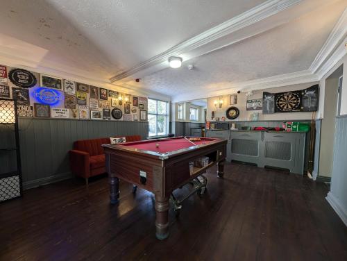a billiard room with a pool table in it at A historic Pub with a modern twist - The Greyhound in Bury Saint Edmunds