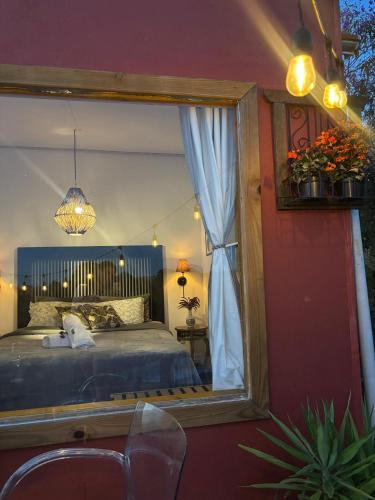 a bedroom with a bed and a large mirror at Bangalô Soberano in Brasilia