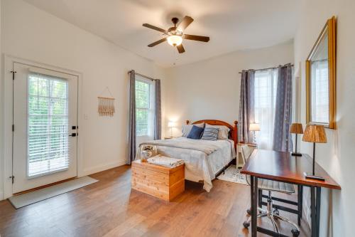 a bedroom with a bed and a ceiling fan at Walk to Historic Maryville True Southern Getaway! in Maryville