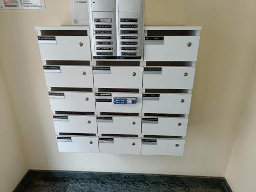 a wall of drawers in a room at Sun and Sea De Haan in De Haan