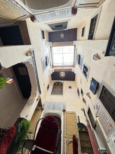 an overhead view of a large room with a staircase at Le panoramique de Fes in Fès
